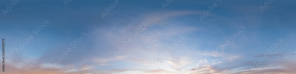 Fototapeta premium Sky panorama clouds over a wide equirectangular view showing soft colorful wisps during sunset or dawn