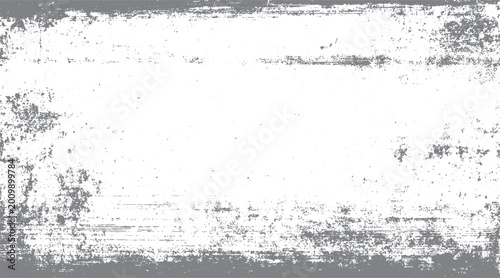 Distressed gray grunge texture with white background and scattered speckles
