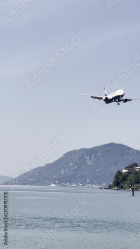 Airplane flying over lake and mountains on a clear day concept of UFO day isolated ink draft blue  