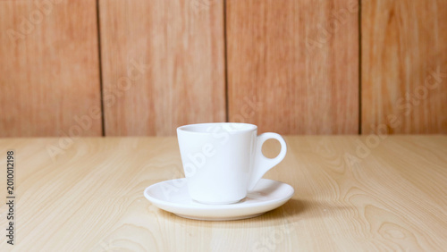Fotografía White Ceramic Coffee Cup and Saucer on Light Wood Table