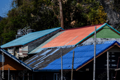 Tablou pe pânză Closeup of houses on the island of Koh Panyi, also known as Koh Panyee, Thailand, a small, Muslim fishing village notable for being built on stilts in the waters of Phang Nga Bay