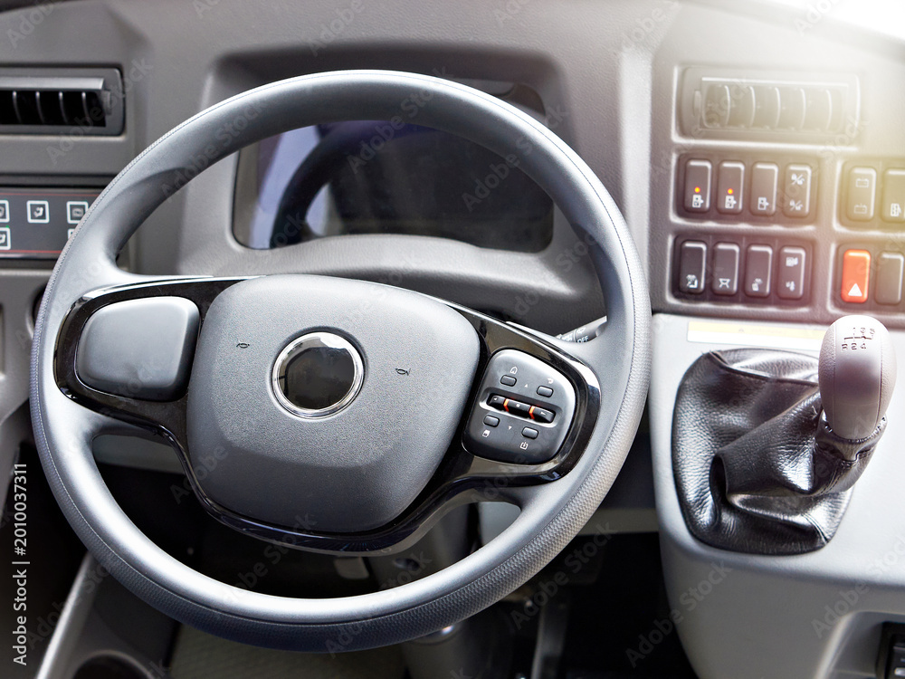 Obraz premium Bus driver cockpit with steering wheel and manual gearbox