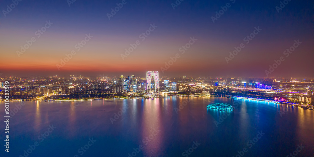Obraz premium Aerial shot of the night skyline of Jinji Lake in Suzhou, Jiangsu Province, China