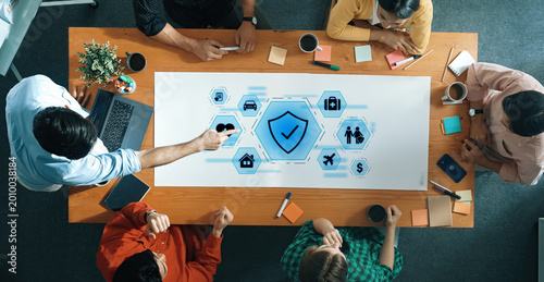 Valokuva A dynamic business meeting showcasing teamwork and collaboration in a modern office