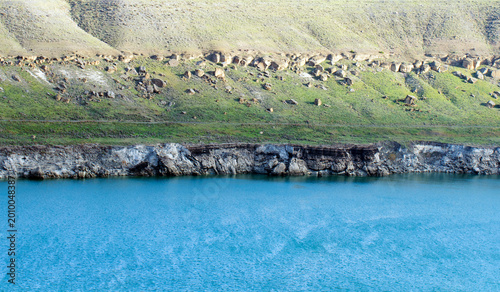 Tableau sur toile Acıgöl in Karapınar, Konya is a volcanic crater lake with salty clear water, rocky shores, and serves as an important stopover for migratory birds at dawn