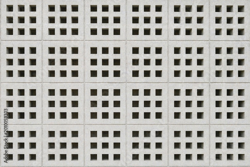 Photos Square roster block texture with hollow grid pattern and rough concrete surface