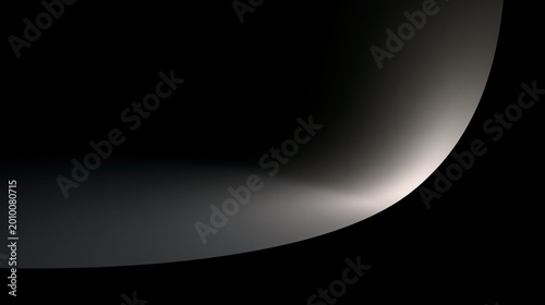 A partial, close-up view of a curved, illuminated planetary ring or atmospheric layer against the blackness of space.