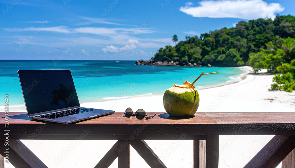 Naklejka premium Experience the ultimate digital nomad lifestyle with a laptop and fresh coconut on a tropical beach terrace. Perfect for travel, remote work, and freedomthemed marketing projects.