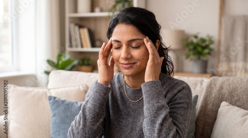 Closeup of woman touching temples for mindful relaxation and stress relief background for wellness and self care design