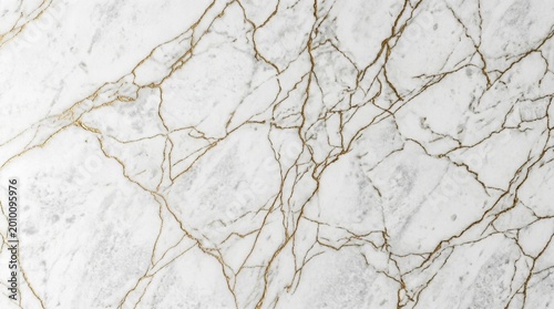 Marble surface with gold veins in elegant luxurious lighting for interior design