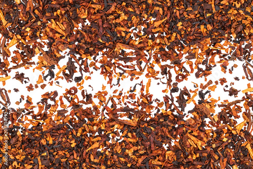Bild auf Leinwand Dry tobacco leaves spread on a white surface showing different shades of brown a