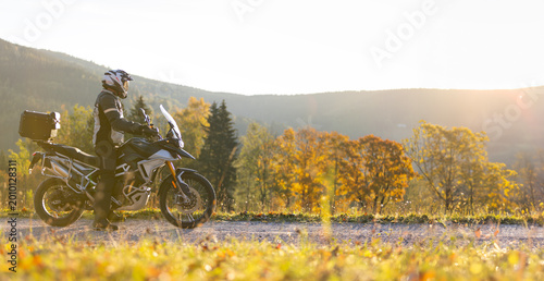 Driver riding motorcycle on empty road
