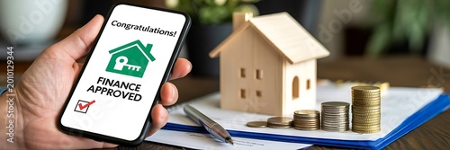 Home loan approval concept with smartphone and house model finance application