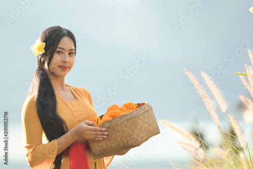 Bali Lady in Traditional dress walk in old temple, indonesia