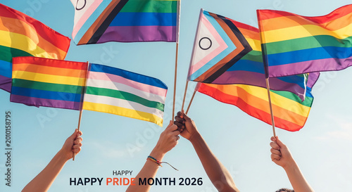 Rainbow and progressive pride flags held against a clear blue sky, symbolizing pride, diversity, and inclusion, with text 