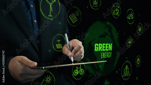 Obraz na płótnie A professional in a suit uses a tablet to explore green energy solutions, surrounded by icons representing renewable resources and sustainable practices for a better future