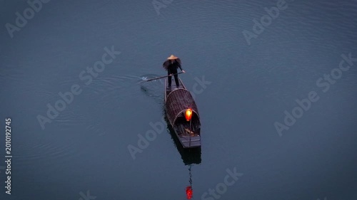 Aerial View of Fishermen cast nets to catch fish in Moon Bay at Wuyuan County, Jiangxi Province, China