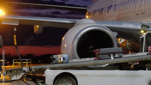 Refueling aircraft aviation kerosene fuel. Airplane suitcases luggage baggage handling conveyor worker man at airport terminal airline. Technician at maintenance loading ground crew aircraft