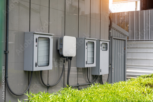 Foto Modern Electrical Utility Boxes and Metering Devices Mounted on Exterior Wall