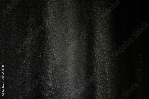 fountain background, water jets of a multi-colored fountain changing color on a black background, musical fountain