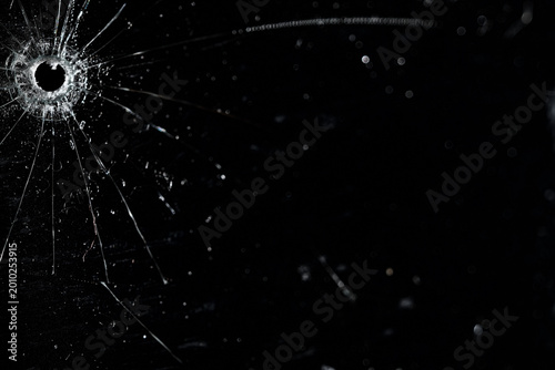 Bullet holes on black glass, overlay design background