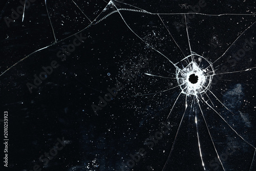 Bullet holes on black glass, overlay design background