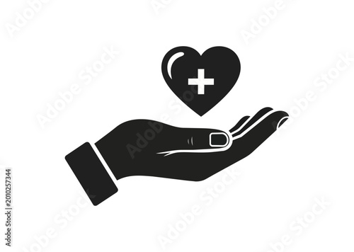 Hand offering red heart symbol on black background