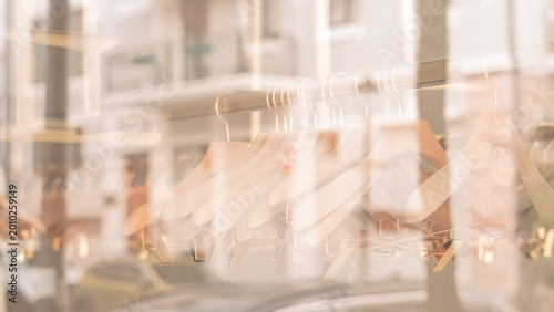 Photos blurred background of a fashion boutique window with hangers