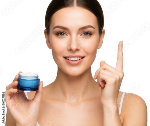 Woman holding open jar of cream on transparent background