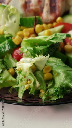 A morning breakfast with rice, fresh vegetables, and meat. Healthy food for weight loss. A delicious dish with lettuce, tomatoes, and corn.