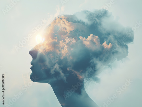 Double Exposure Profile of Woman with Cloudscape and Sunlight