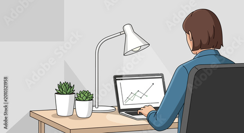 woman sitting at desk working on laptop with plants and lamp.
