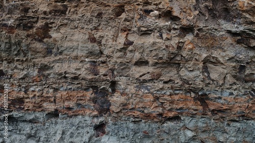 фотографія Natural soil stratification and eroded earth rock texture background
