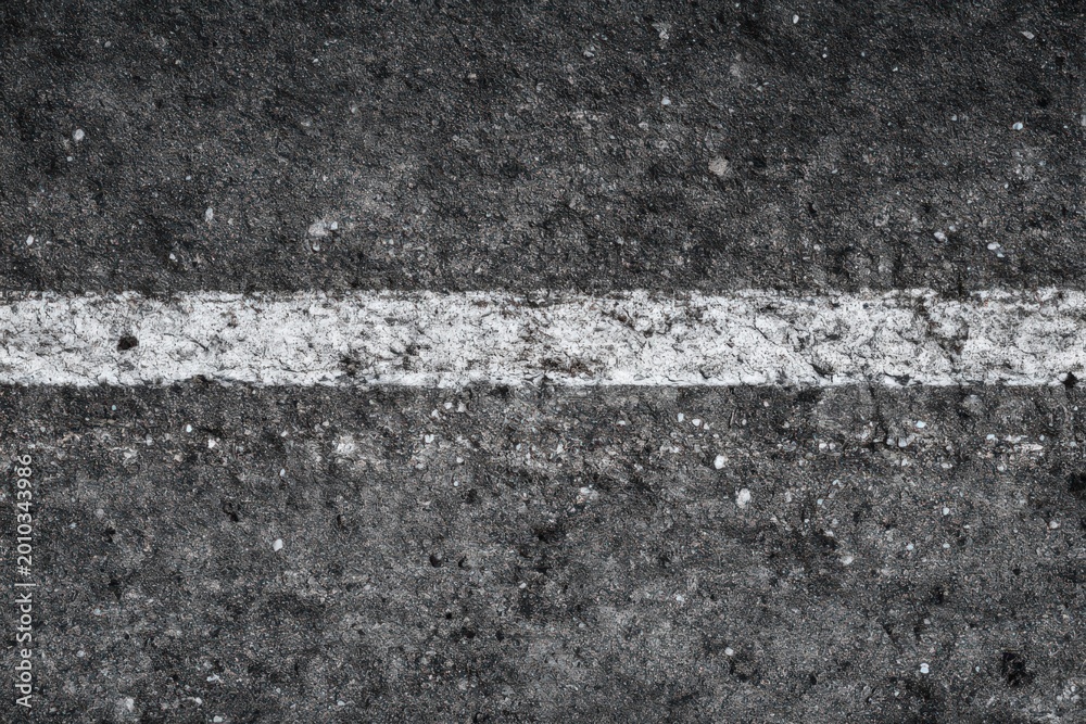 Fototapeta premium Rough Asphalt Surface White Painted Line Horizontal Coarse Texture Stones Cracks Urban Road Infrastructure Background