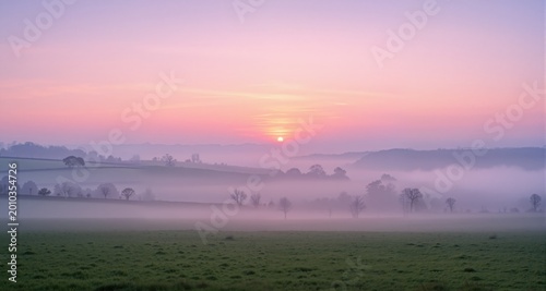 Beautiful foggy sunrise in English countryside with soft pastel sky and calm feeling : Generative AI

