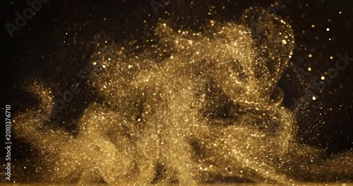 Golden dust particles swirling in the air, creating a magical atmosphere against a dark backdrop