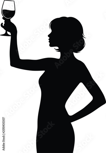 Fotografija Elegant silhouette of a woman holding a wine glass aloft