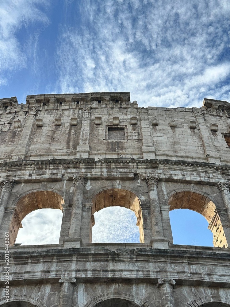 Obraz premium Colosseum in Rome from low angle with dramatic sky