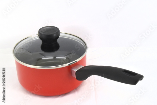 Quadro su tela Red cooking saucepan with lid and ergonomic handle, suitable for modern kitchen,