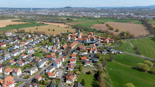 Bild auf Leinwand Aerial View Propstei Johannesberg, , Benedictine priory, district of Fulda in Hesse, Roman Catholic parish church of St