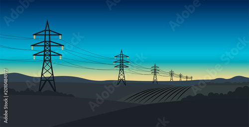 Photos Torres de alta tensión y líneas eléctricas atravesando un paisaje rural al amane