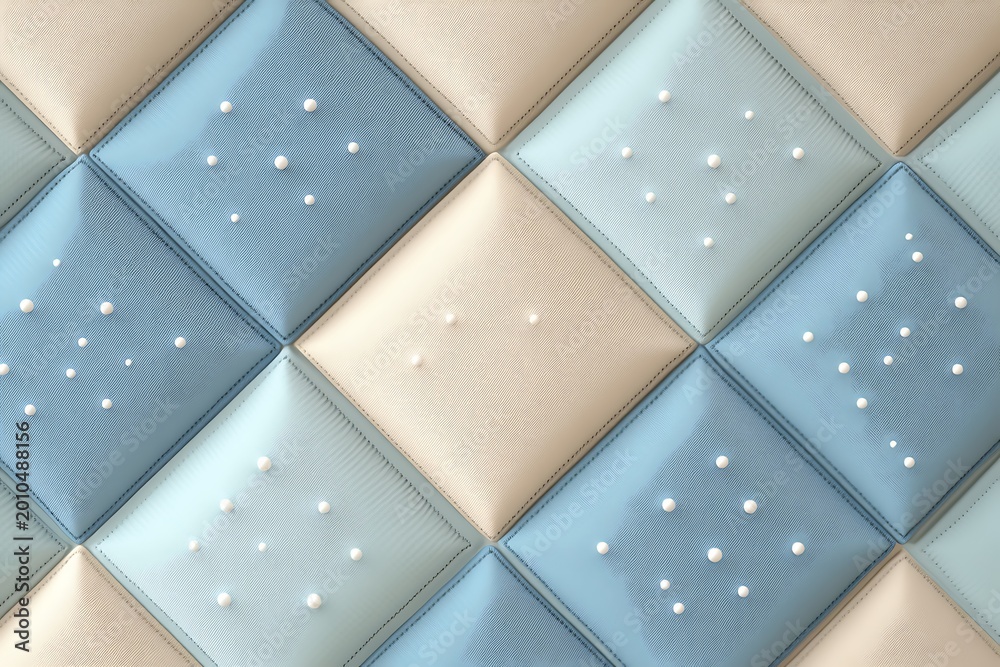 Fototapeta premium A luxurious quilted pattern featuring soft light blue and cream diamond shaped panels with small pearls