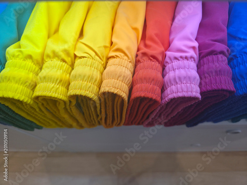 many colors male swimsuits in a folder