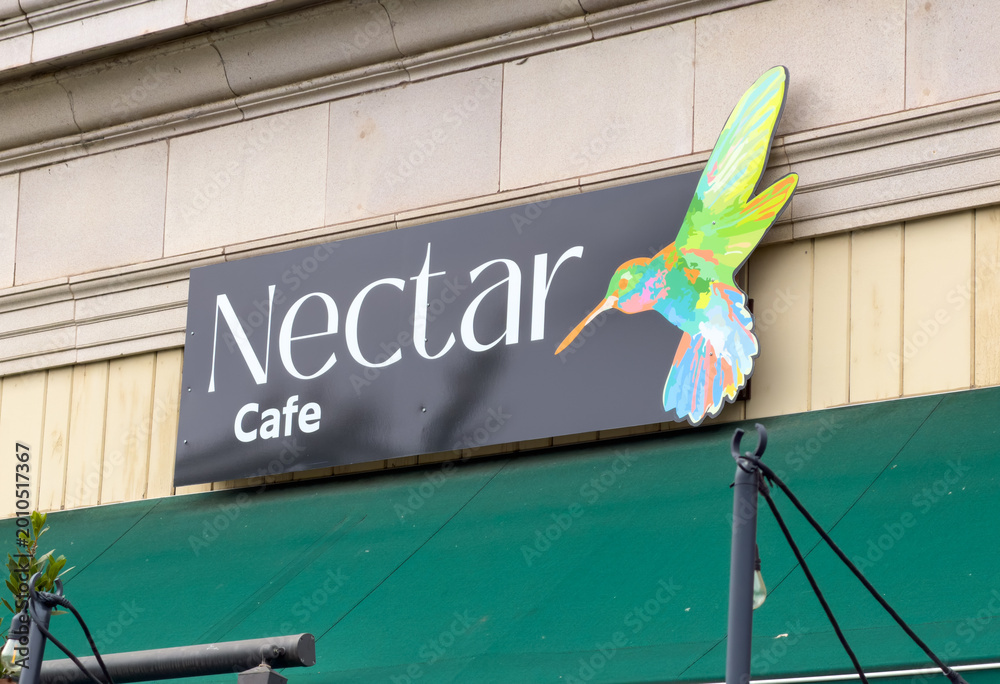 Fototapeta premium Nectar Cafe Sign With Colorful Hummingbird Logo