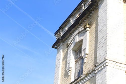 Doles Manor House, Latvia. Historic manor roof detail on a sunny day. Warm sunlight highlights aged roof tiles and traditional architecture, showcasing heritage, texture, and timeless European country