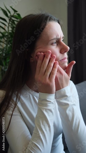 Close up of young woman suffering touching cheek, female feeling painful toothache. Teeth pain and dentistry, jaw pain, health care concept. Unhappy feel bad, diseases in oral, ache nerve and molar