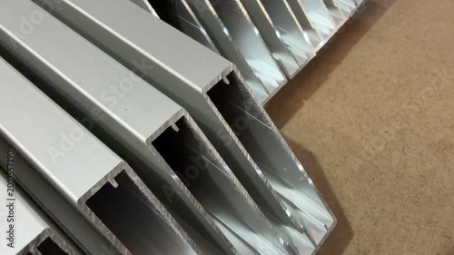 Stacked aluminium profiles demonstrating their versatility and application in modern construction projects.
