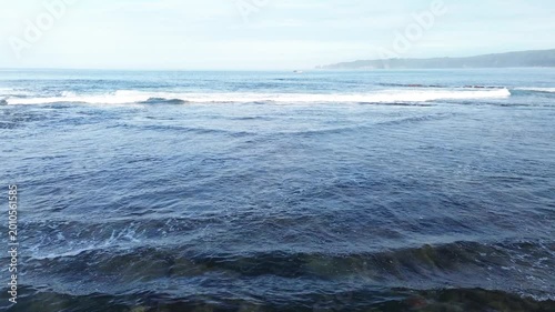 Beautiful Ocean Waves Crashing on Tropical Coastline
