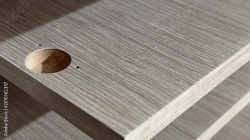 A close-up shot of a sleek wooden shelf with a brushed texture, highlighting the clean, precise edge and subtle wood grain details. Perfect for furniture catalogues.