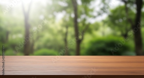 Empty wooden tabletop with blurred forest background natural light